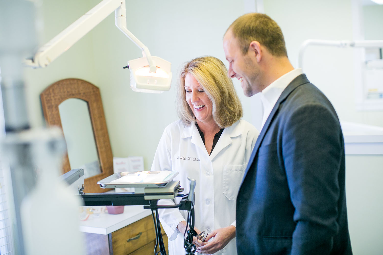 Dr. Collins interacting with patients and parents Dr. Collins interacting with patients and parents